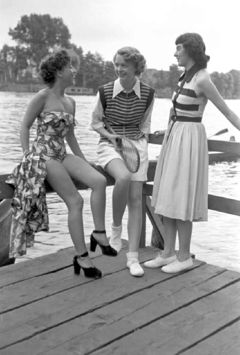 Young people present current summer swimwear on the shore of the Rummelsburg Bay on the street Paul-und-Paula-Ufer in the district of Rummelsburg in Berlin East Berlin in the area of the former GDR, German Democratic Republic