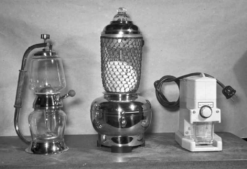 Appliances for making coffee, such as electric vacuum maker, pump percolator and electric coffee grinder at home in Berlin East Berlin in the area of the former GDR, German Democratic Republic