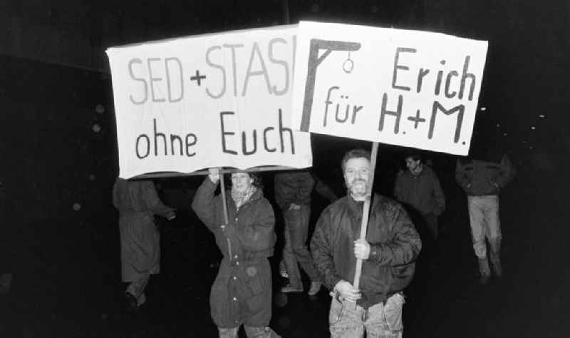 Demonstrators and protesters during the storming and occupation the headquarters of the MfS Ministry for State Security on street Ruschestrasse - Normannenstrasse in the district Lichtenberg in Berlin Eastberlin on the territory of the former GDR, German Democratic Republic