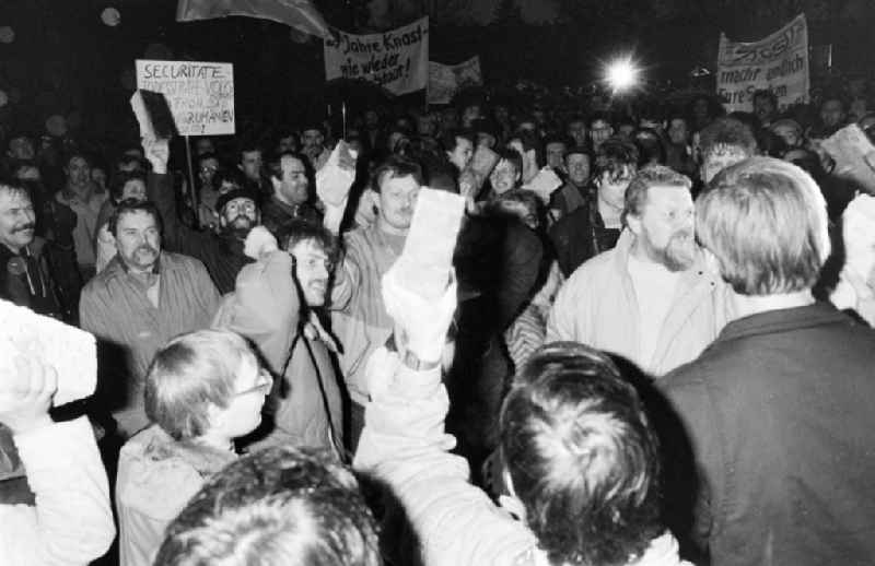 Demonstrators and protesters during the storming and occupation the headquarters of the MfS Ministry for State Security on street Ruschestrasse - Normannenstrasse in the district Lichtenberg in Berlin Eastberlin on the territory of the former GDR, German Democratic Republic