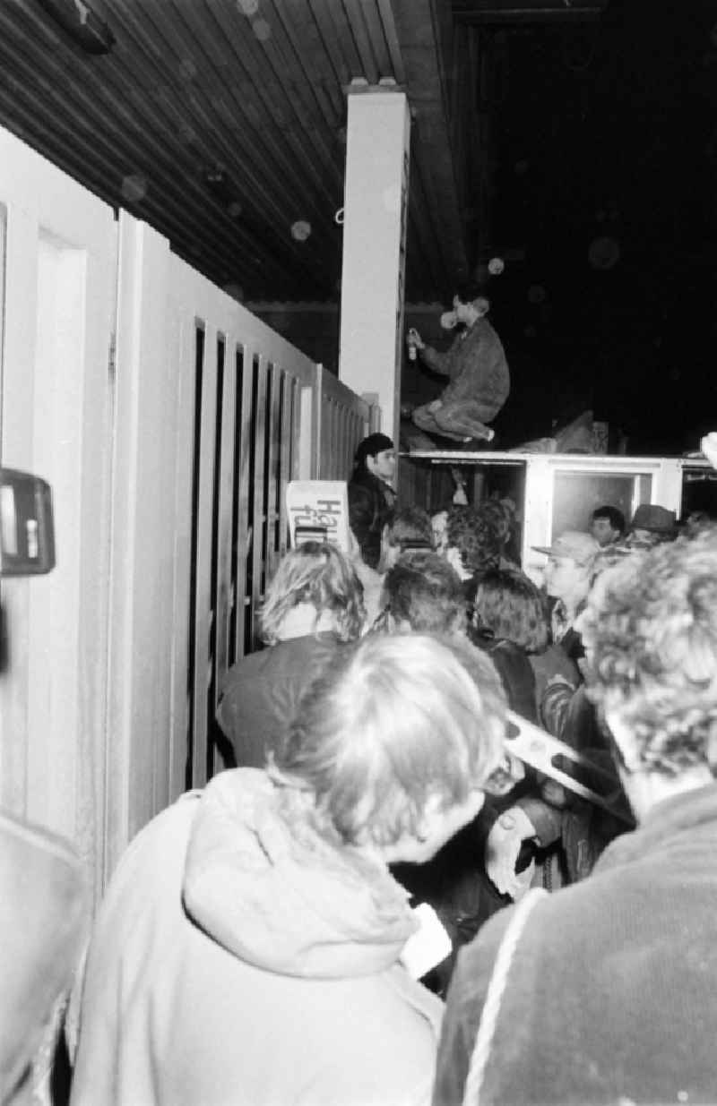 Demonstrators and protesters during the storming and occupation the headquarters of the MfS Ministry for State Security on street Ruschestrasse - Normannenstrasse in the district Lichtenberg in Berlin Eastberlin on the territory of the former GDR, German Democratic Republic