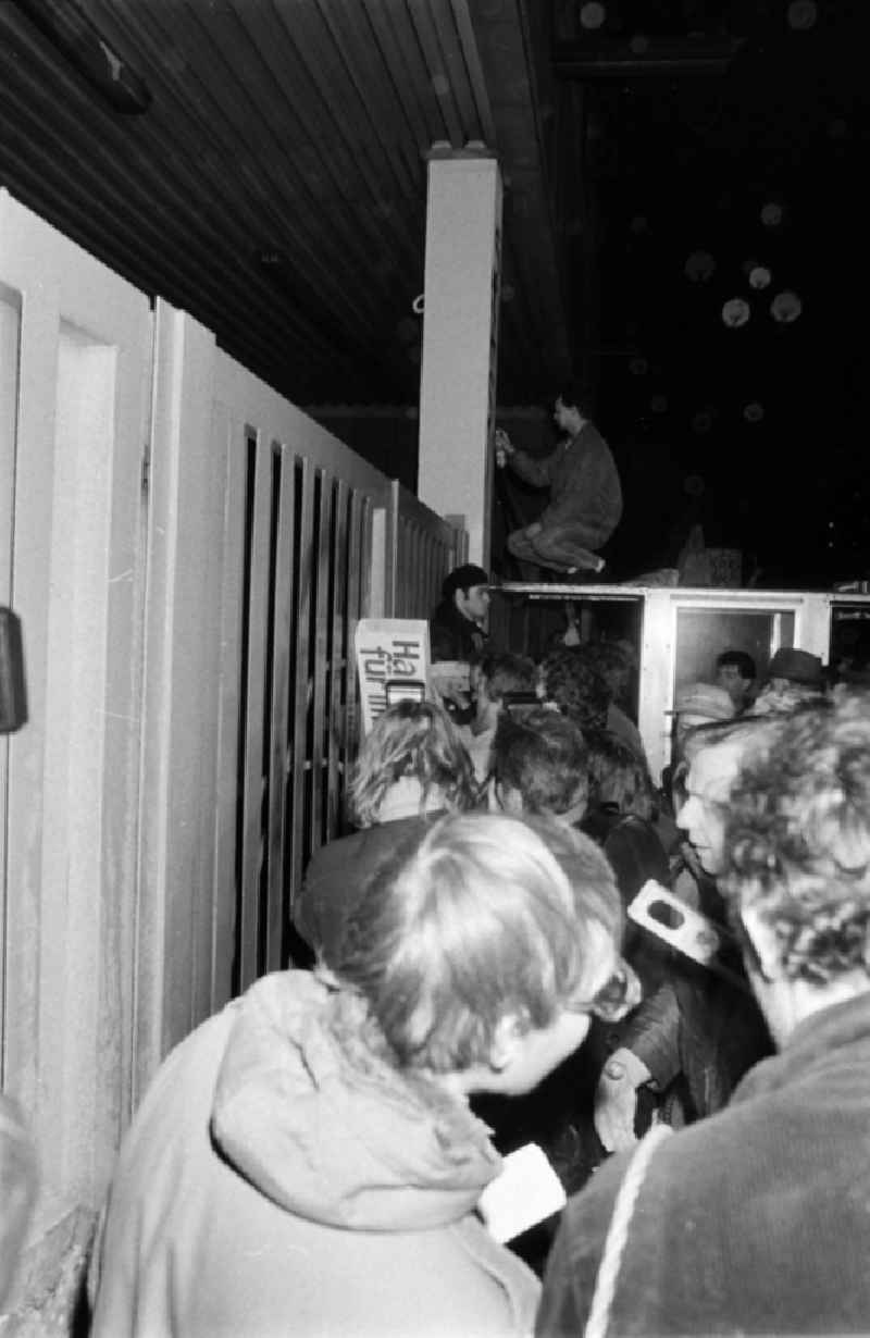 Demonstrators and protesters during the storming and occupation the headquarters of the MfS Ministry for State Security on street Ruschestrasse - Normannenstrasse in the district Lichtenberg in Berlin Eastberlin on the territory of the former GDR, German Democratic Republic