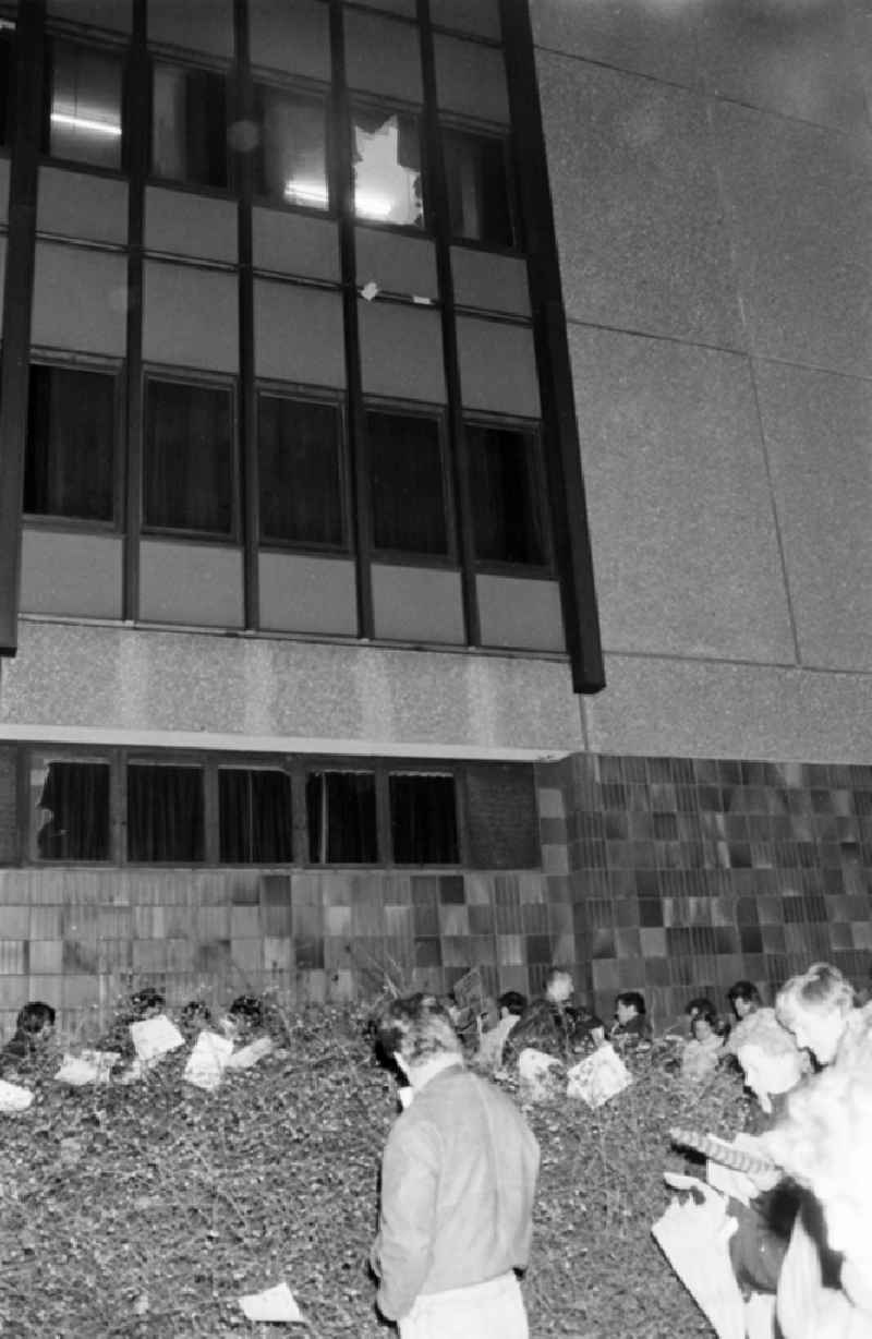 Demonstrators and protesters during the storming and occupation the headquarters of the MfS Ministry for State Security on street Ruschestrasse - Normannenstrasse in the district Lichtenberg in Berlin Eastberlin on the territory of the former GDR, German Democratic Republic