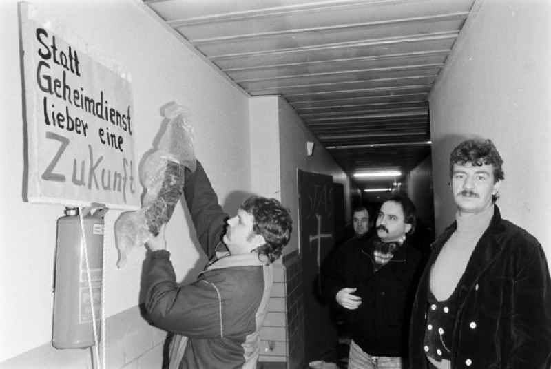 Demonstrators and protesters during the storming and occupation the headquarters of the MfS Ministry for State Security on street Ruschestrasse - Normannenstrasse in the district Lichtenberg in Berlin Eastberlin on the territory of the former GDR, German Democratic Republic