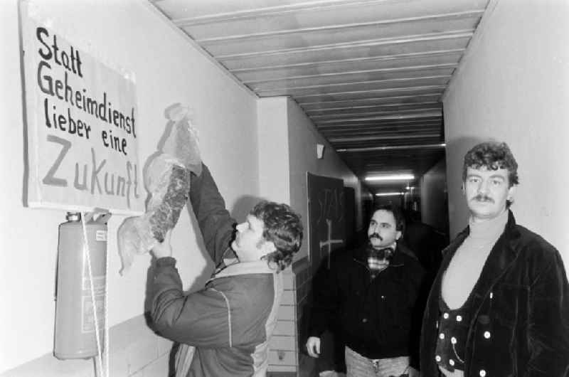 Demonstrators and protesters during the storming and occupation the headquarters of the MfS Ministry for State Security on street Ruschestrasse - Normannenstrasse in the district Lichtenberg in Berlin Eastberlin on the territory of the former GDR, German Democratic Republic