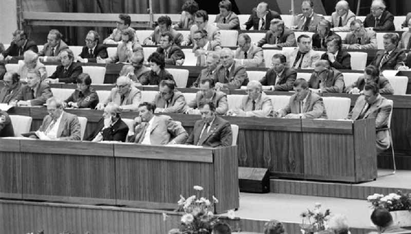 Delegates during the meeting in the 'Great Hall of the Palace of the Republic' on the occasion of the '7th Building Conference' in the Mitte district of East Berlin in the territory of the former GDR, German Democratic Republic