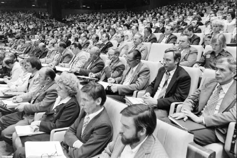 Delegates during the meeting in the 'Great Hall of the Palace of the Republic' on the occasion of the '7th Building Conference' in the Mitte district of East Berlin in the territory of the former GDR, German Democratic Republic