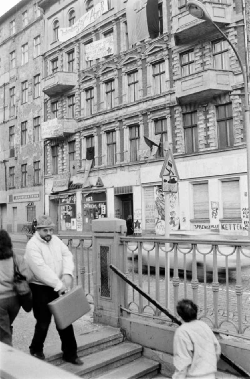 Facades of an occupied old apartment building Schoenhauser Allee 2