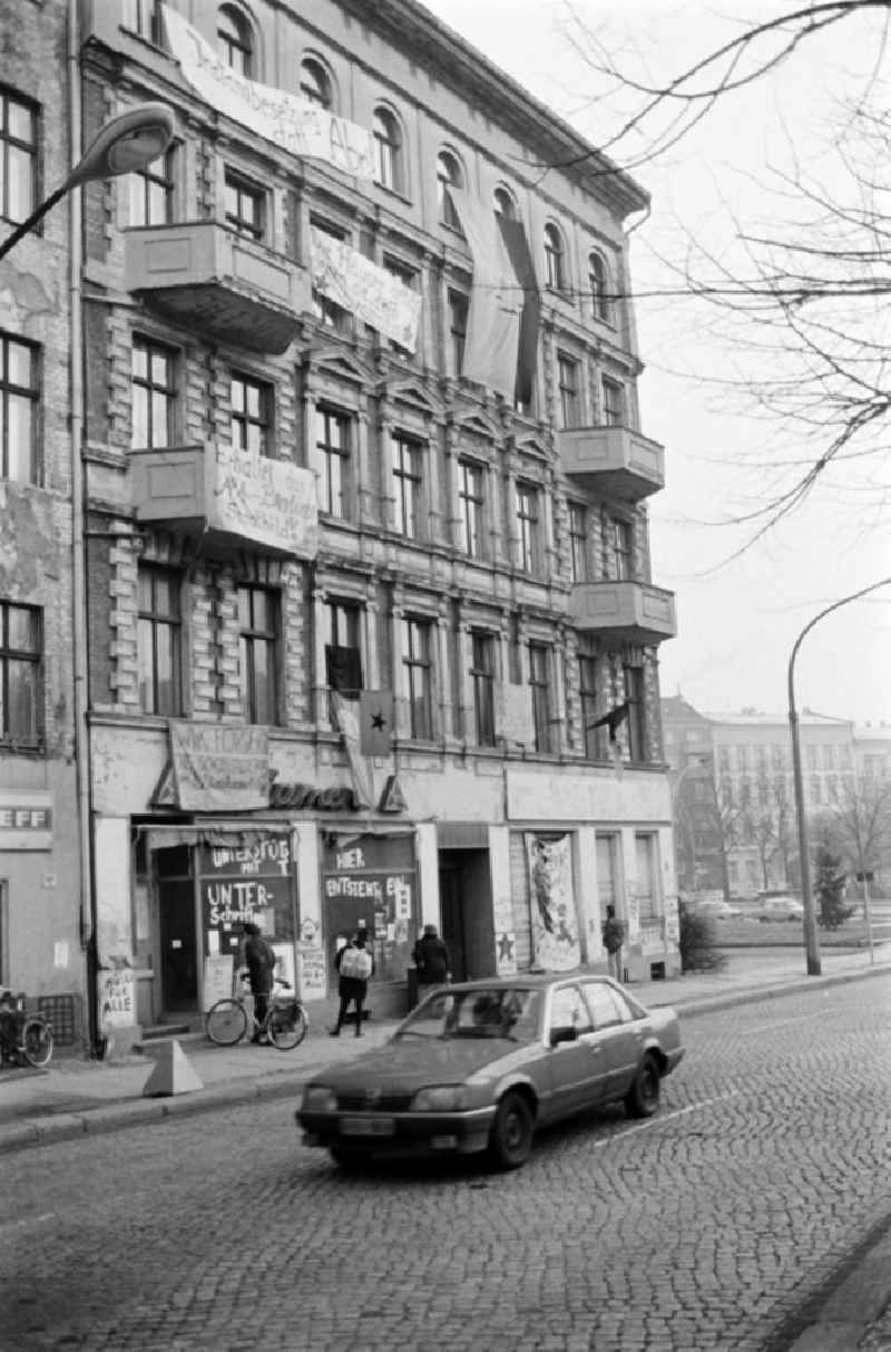 Facades of an occupied old apartment building Schoenhauser Allee 2