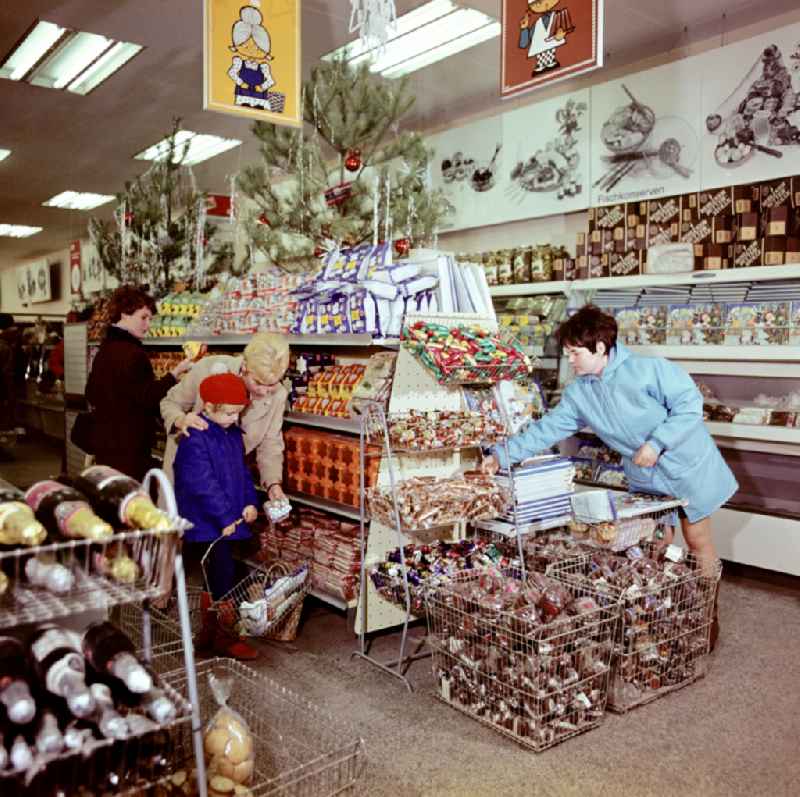 Mall shopping center with shelf offers for Christmas time on street Spandauer Strasse in the district Mitte in Berlin Eastberlin on the territory of the former GDR, German Democratic Republic