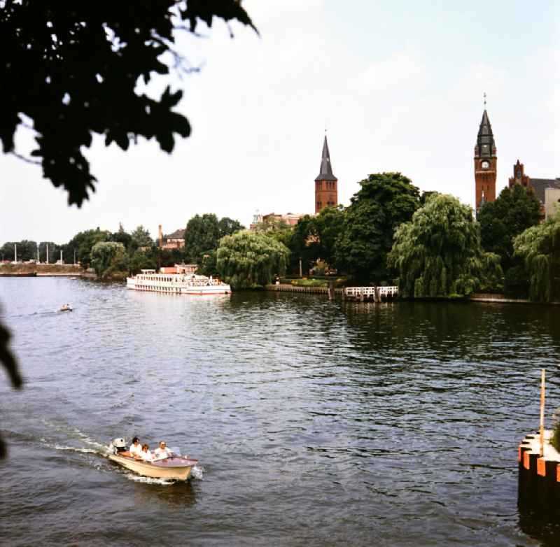 Passenger ship at the pier at the Luisenhain park and a boat on the Dahme in Koepenick in East Berlin on the territory of the former GDR, German Democratic Republic