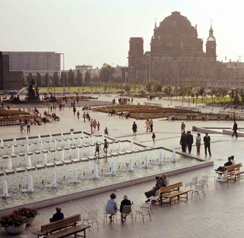 Popular water feature - fountain 'Neptunbrunnen' with a view of the Berlin Cathedral on the Alexanderplatz in Berlin East Berlin on the territory of the former GDR, German Democratic Republic