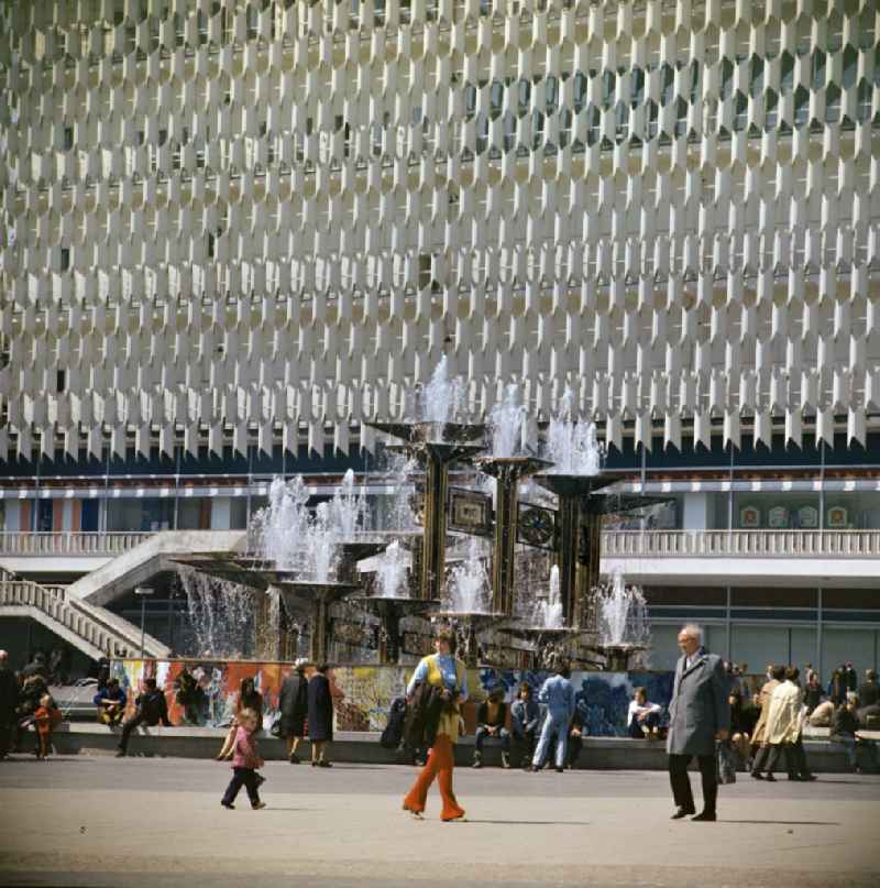 Popular water feature - fountain 'Fountain of Friendship of Peoples' on Alexanderplatz in front of the Centrum department store in the Mitte district of Berlin East Berlin on the territory of the former GDR, German Democratic Republic