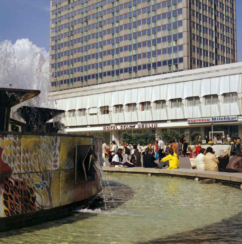 Popular water feature - fountain 'Fountain of Friendship between Peoples' on Alexanderplatz with a view of the 'Hotel Stadt Berlin' in the Mitte district of Berlin East Berlin on the territory of the former GDR, German Democratic Republic