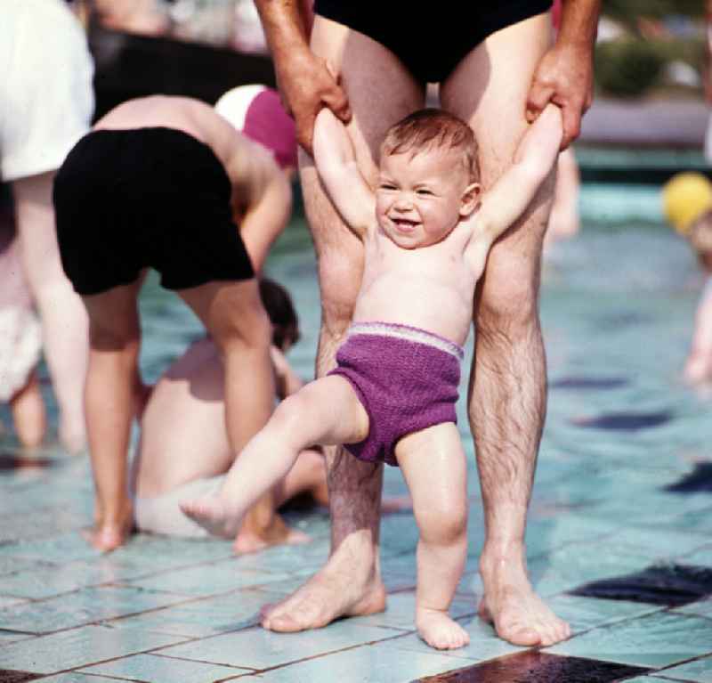 Little boy in an outdoor swimming pool on Wolfshagener Strasse in the Pankow district of Berlin, East Berlin, in the territory of the former GDR, German Democratic Republic