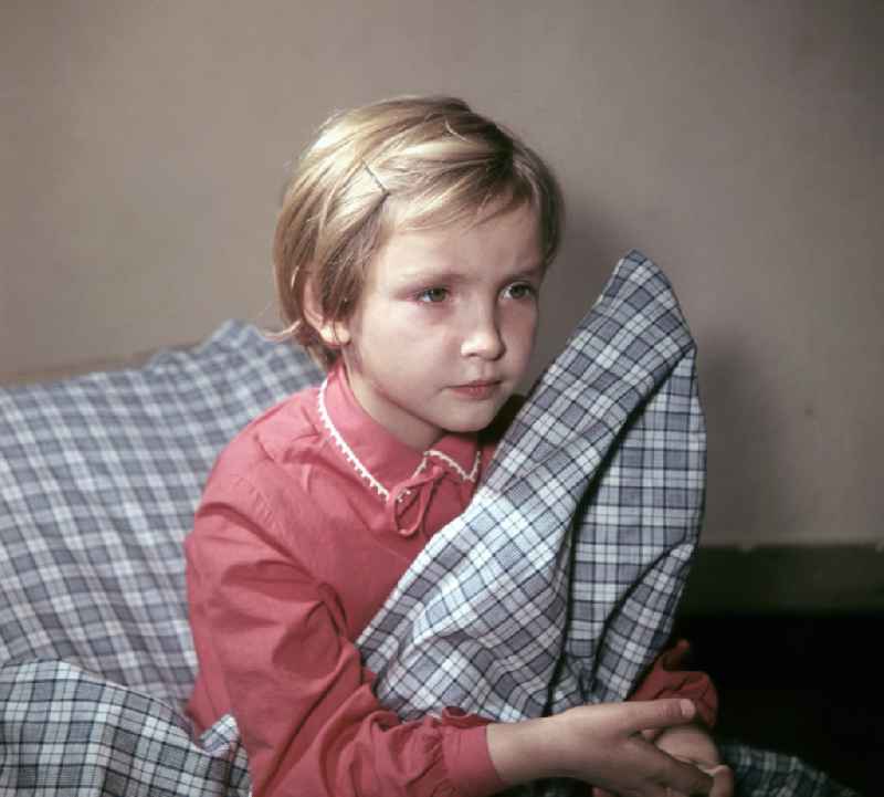 A little girl taking a nap in the kindergarten on Michael-Brueckner-Strasse in the Schoeneweide district of Berlin in the territory of the former GDR, German Democratic Republic