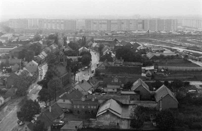 Village center of Alt-Marzahn in front of the facades of an industrially manufactured prefabricated housing estate in the district of Marzahn in Berlin East Berlin in the area of the former GDR, German Democratic Republic