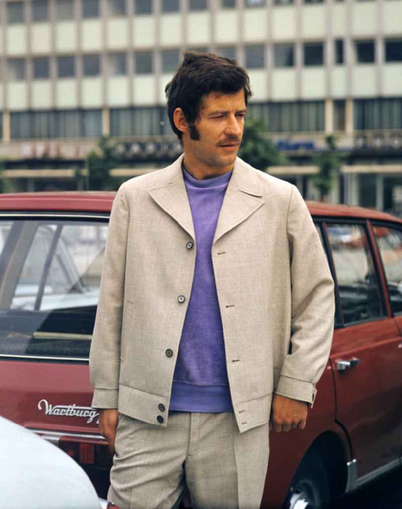 A model presents current men's fashion - men's fashion collection in the Mitte district of Berlin East Berlin in the area of the former GDR, German Democratic Republic