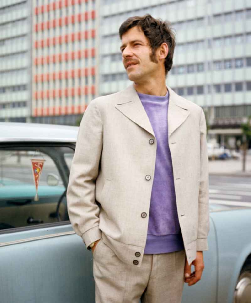 A model presents current men's fashion - men's fashion collection in the Mitte district of Berlin East Berlin in the area of the former GDR, German Democratic Republic