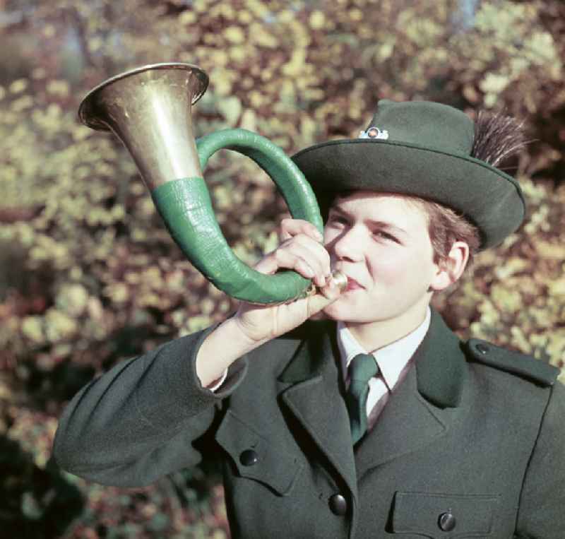 Forester with hunting horn in Berlin East Berlin in the territory of the former GDR, German Democratic Republic