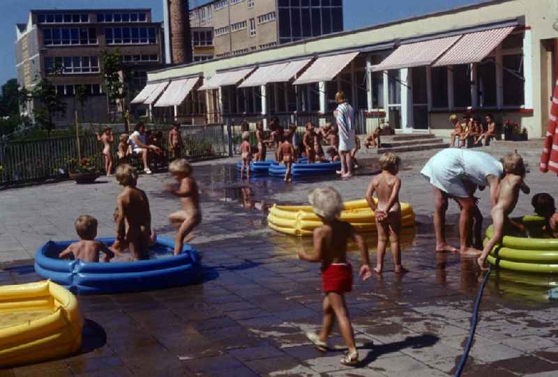 Children play in the garden of a daycare center in Bernau near Berlin in the state of Brandenburg on the territory of the former GDR, German Democratic Republic