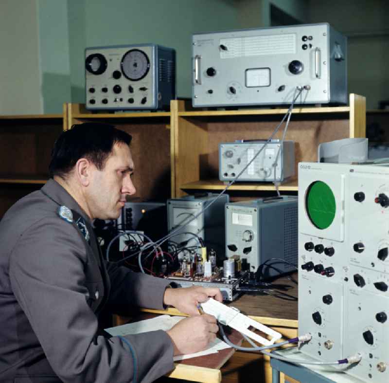 Lieutenant Colonel of the Air Force at work at a test station for radio measuring technology in the National People's Army NVA office in Dresden, Saxony in the territory of the former GDR, German Democratic Republic