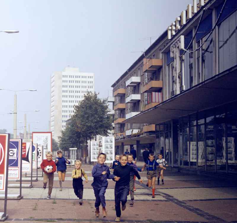 Children and young people having fun playing ball on Karl-Marx-Strasse in Frankfurt (Oder), Brandenburg in the area of the former GDR, German Democratic Republic