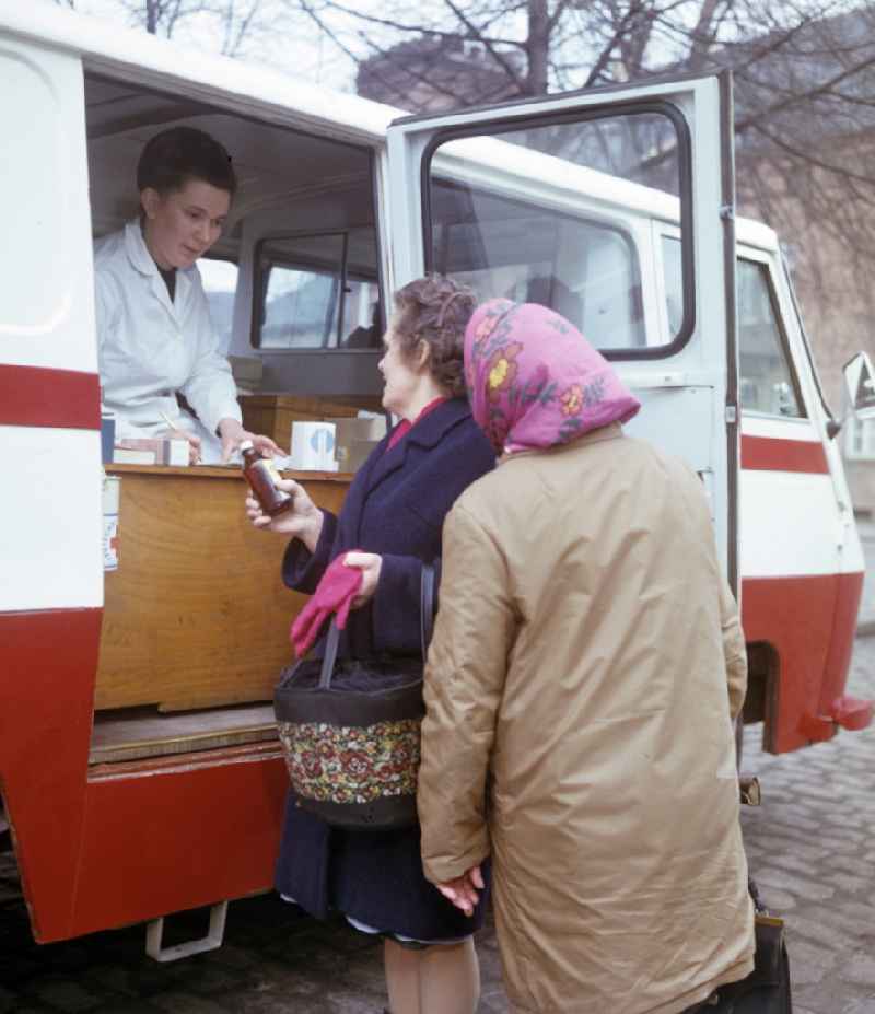 Dispensing and ordering medication at a mobile pharmacy, photographed in the 196