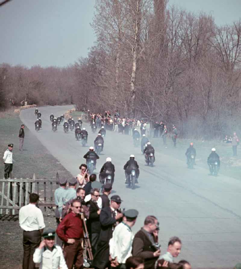 Drivers and spectators during the motorcycle race at the Sachsenring in Hohenstein-Ernstthal, Saxony in the territory of the former GDR, German Democratic Republic