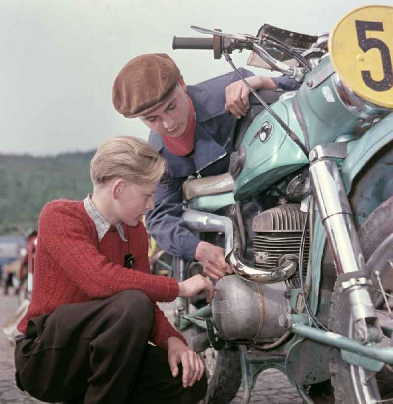 Checking a participating MZ motorcycle before the race at the Sachsenring in Hohenstein-Ernstthal, Saxony in the territory of the former GDR, German Democratic Republic