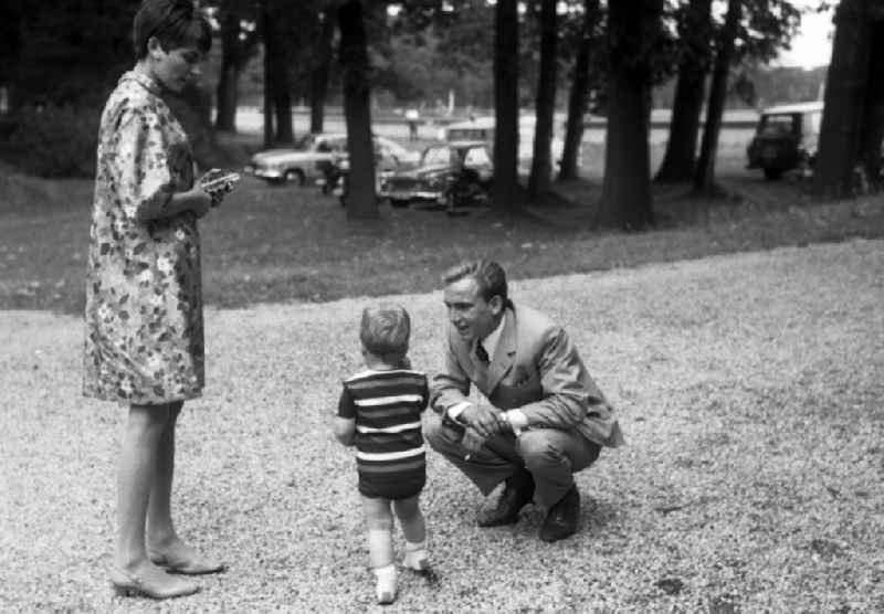 Man, woman and toddler on a walk in Hoppegarten in the state Brandenburg on the territory of the former GDR, German Democratic Republic