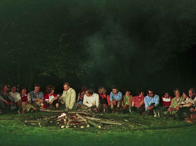 Scene shot of Sorbian villagers at a nighttime campfire during the film and television production ' Portrait of a Center ' on the main street in Horka, Saxony in the area of the former GDR, German Democratic Republic