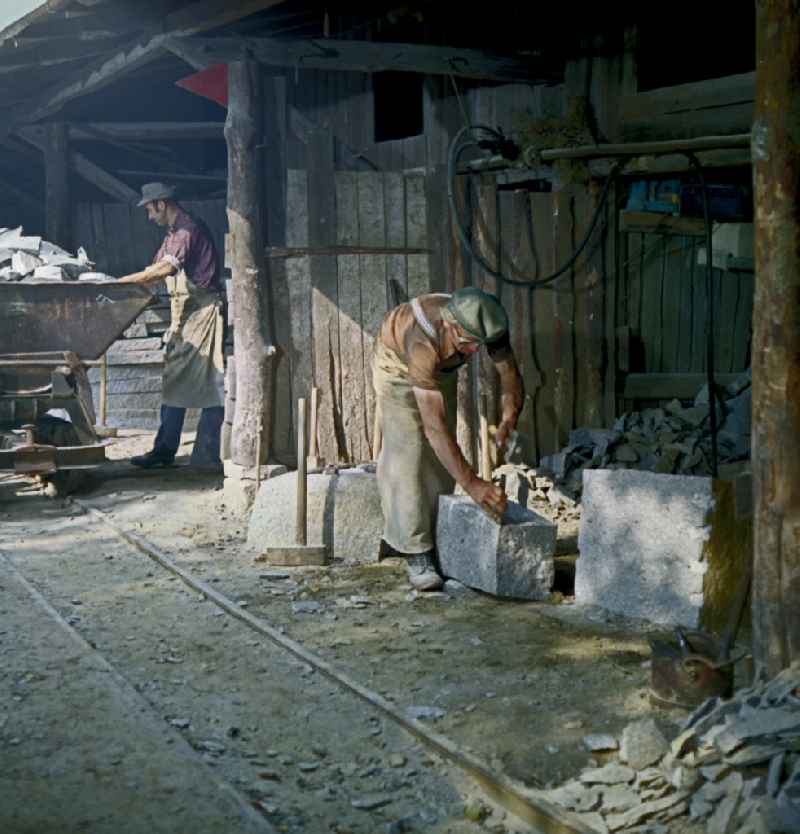 Quarry workers as a scene from the film and television production ' Portrait of a Center ' on the main street in Horka, Saxony in the area of the former GDR, German Democratic Republic