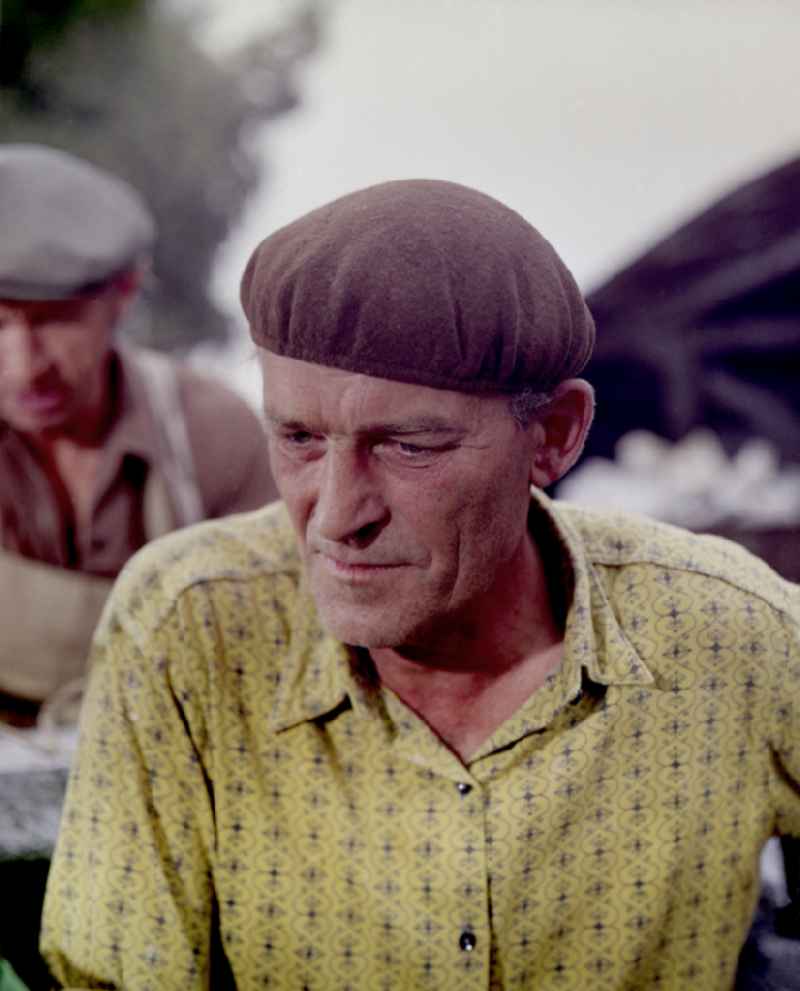 Quarry workers as a scene from the film and television production ' Portrait of a Center ' on the main street in Horka, Saxony in the area of the former GDR, German Democratic Republic