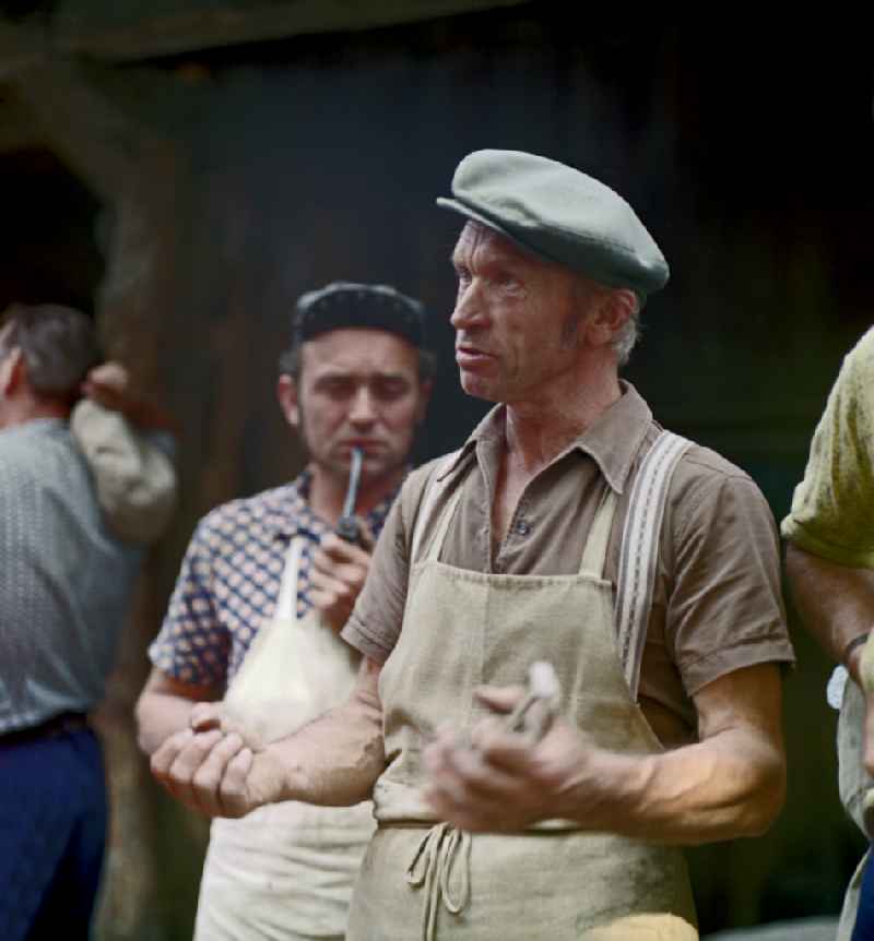 Quarry workers as a scene from the film and television production ' Portrait of a Center ' on the main street in Horka, Saxony in the area of the former GDR, German Democratic Republic