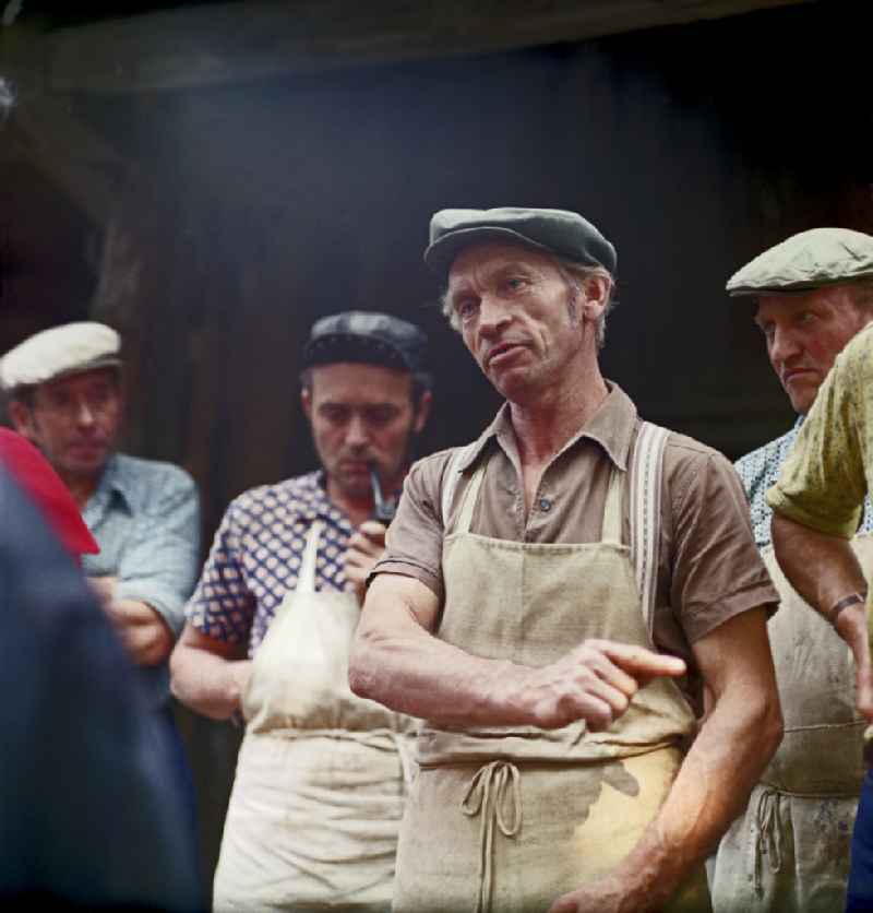 Quarry workers as a scene from the film and television production ' Portrait of a Center ' on the main street in Horka, Saxony in the area of the former GDR, German Democratic Republic