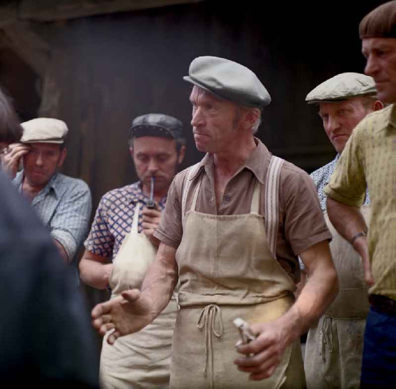 Quarry workers as a scene from the film and television production ' Portrait of a Center ' on the main street in Horka, Saxony in the area of the former GDR, German Democratic Republic