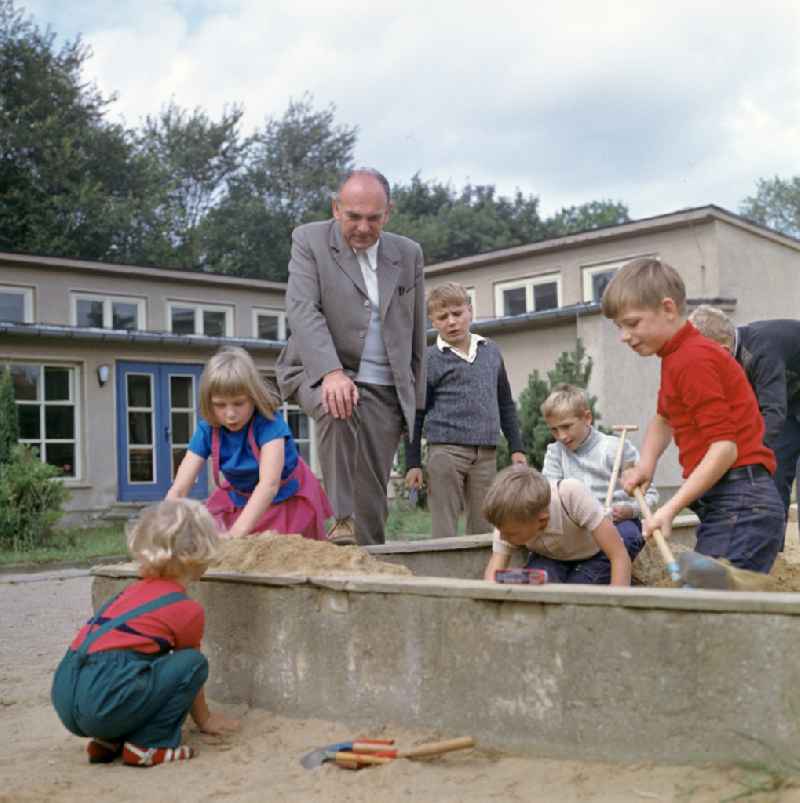 Children suffering from diabetes play in the sand in front of the Central Institute for Diabetes 'Gerhardt Katsch' in Karlsburg, Mecklenburg-Western Pomerania in the territory of the former GDR, German Democratic Republic