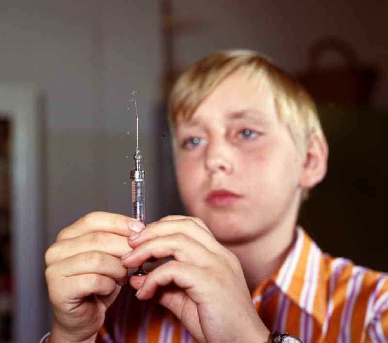 A boy prepares his insulin injection at the Central Institute for Diabetes 'Gerhardt Katsch' in Karlsburg, Mecklenburg-Vorpommern in the territory of the former GDR, German Democratic Republic