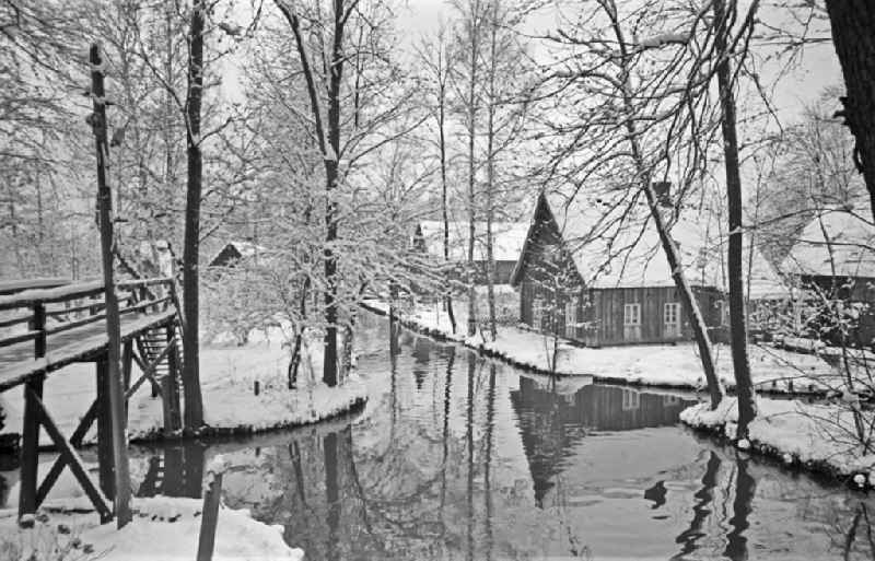Winter snow-covered canal course and bank areas of the main Spree in Lehde Spreewald, Brandenburg in the area of ??the former GDR, German Democratic Republic