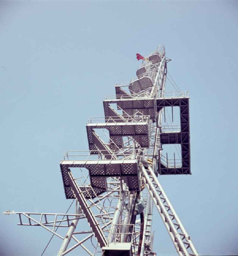 Conveyor tower and oil rig arrangement for the gas support on the railing of the Leipzig fair in Leipzig in the federal state Saxony in the area of the former GDR, German democratic republic
