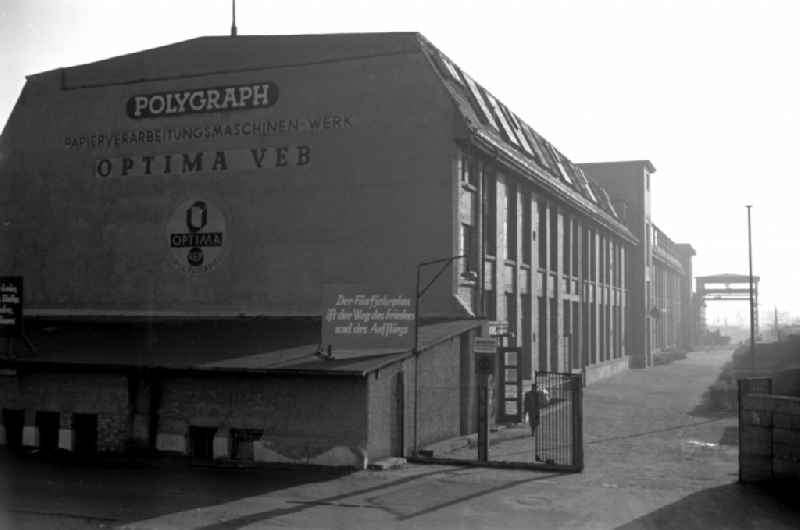 The slogan 'The Five-Year Plan is the path to peace and prosperity' is written at the entrance of the Polygraph paper processing machine factory Optima VEB in Leipzig, Saxony in the territory of the former GDR, German Democratic Republic