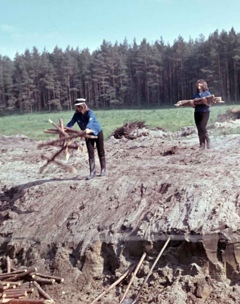 FDJ members carrying out land reclamation work to drain agricultural land in Nauen, Brandenburg in the territory of the former GDR, German Democratic Republic