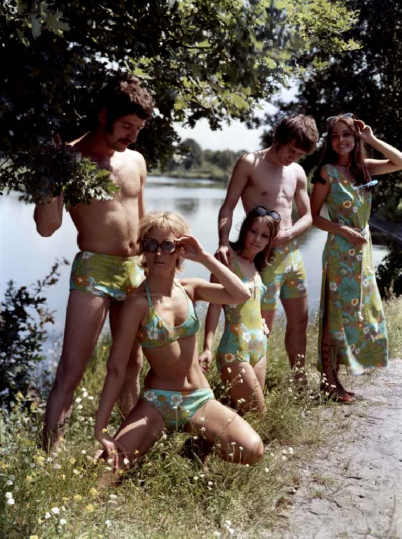 Young people present the latest summer swimwear in Pirna in the state Saxony on the territory of the former GDR, German Democratic Republic
