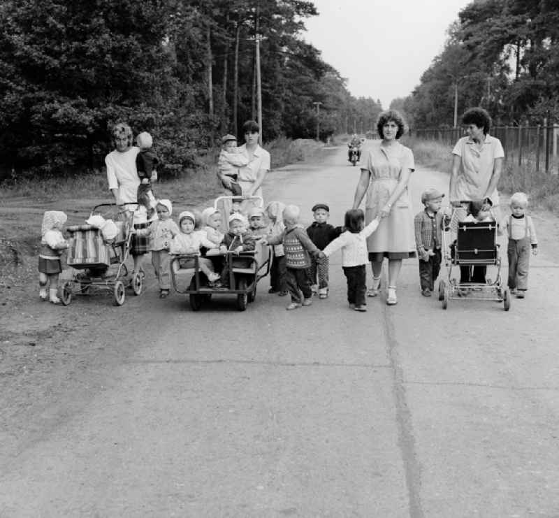 Educators take the nursery school children for a walk in Prora in the federal state Mecklenburg-Vorpommern on the territory of the former GDR, German Democratic Republic