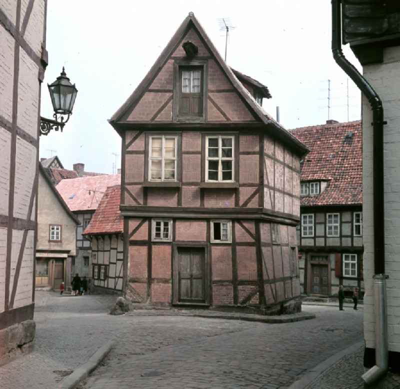 Half-timbered facade and building front south gable in the street Finkenherd in the city center of Quedlinburg, Saxony-Anhalt in the territory of the former GDR, German Democratic Republic