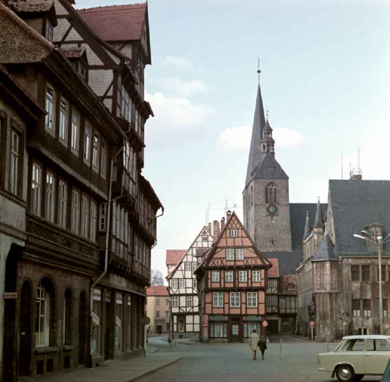 Half-timbered facade and building front in front of the market church St. Benedicti on the street Markt in Quedlinburg, Saxony-Anhalt in the area of the former GDR, German Democratic Republic