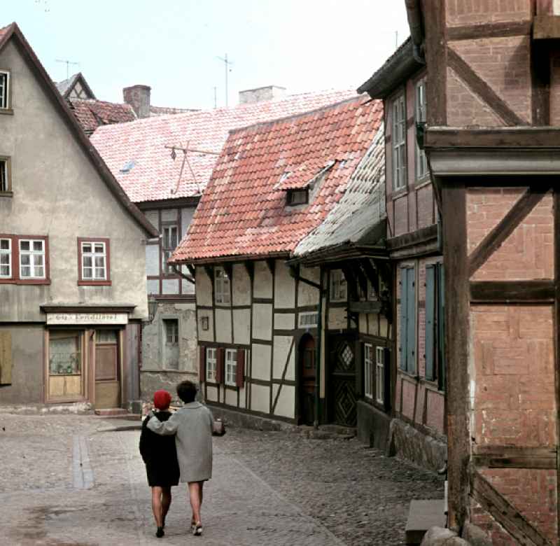 Street scene between half-timbered houses in the town of Quedlinburg, Saxony-Anhalt in the area of the former GDR, German Democratic Republic