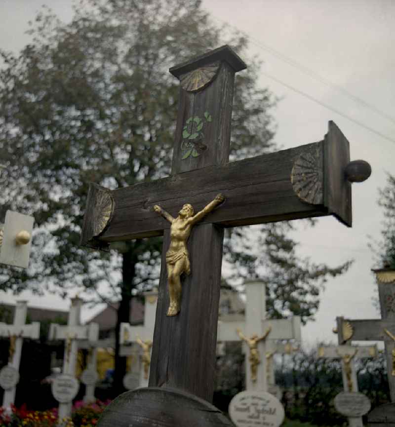 Cultural-historical grave cross and gravestone ensemble in the Sorbian cemetery on the main street in Ralbitz-Rosenthal, Saxony in the territory of the former GDR, German Democratic Republic