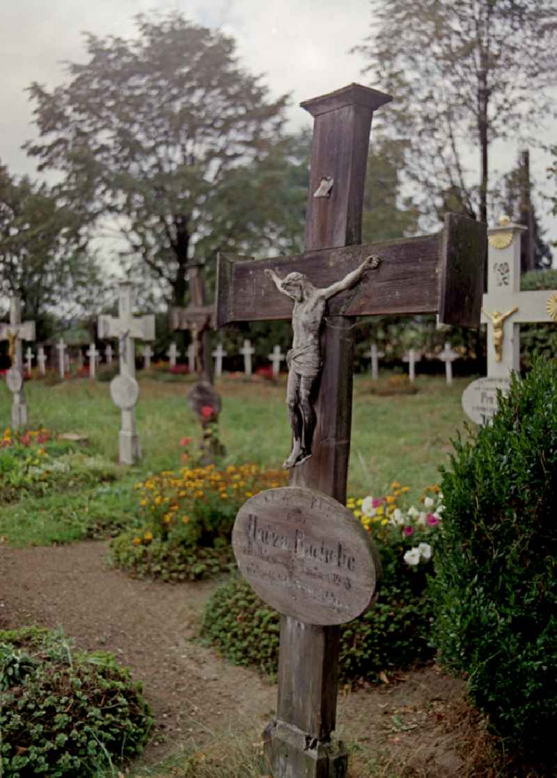 Cultural-historical grave cross and gravestone ensemble in the Sorbian cemetery on the main street in Ralbitz-Rosenthal, Saxony in the territory of the former GDR, German Democratic Republic